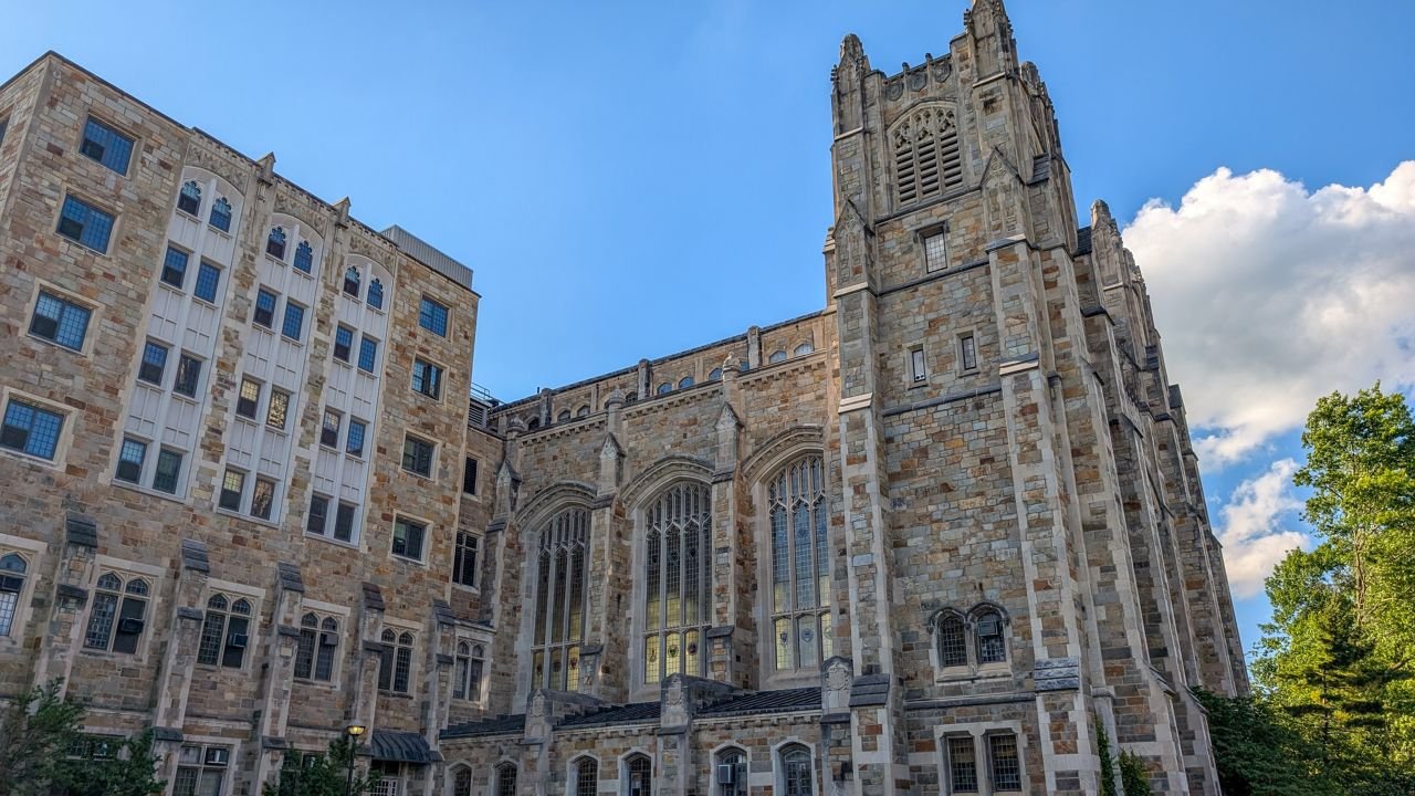 Stunning gothic architecture of a historic university building on a clear day.